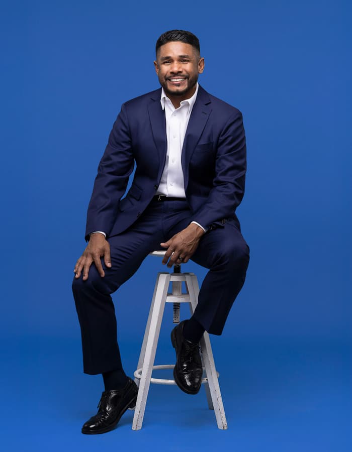 Barjes sitting on a stool